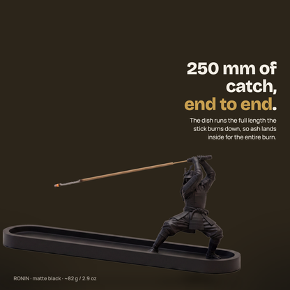 RONIN samurai incense holder — matte black 3D-printed figure holding a burning incense stick over a 250 mm ash dish